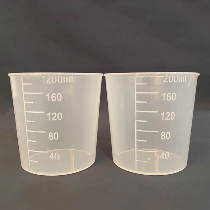 Moldeo de taza de medición de plástico